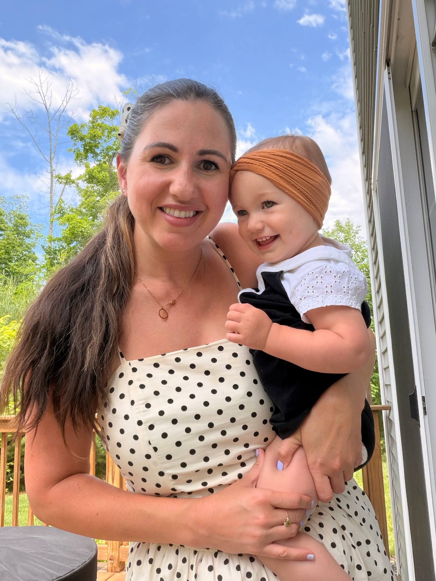 Michelle Unger holding her baby outdoors